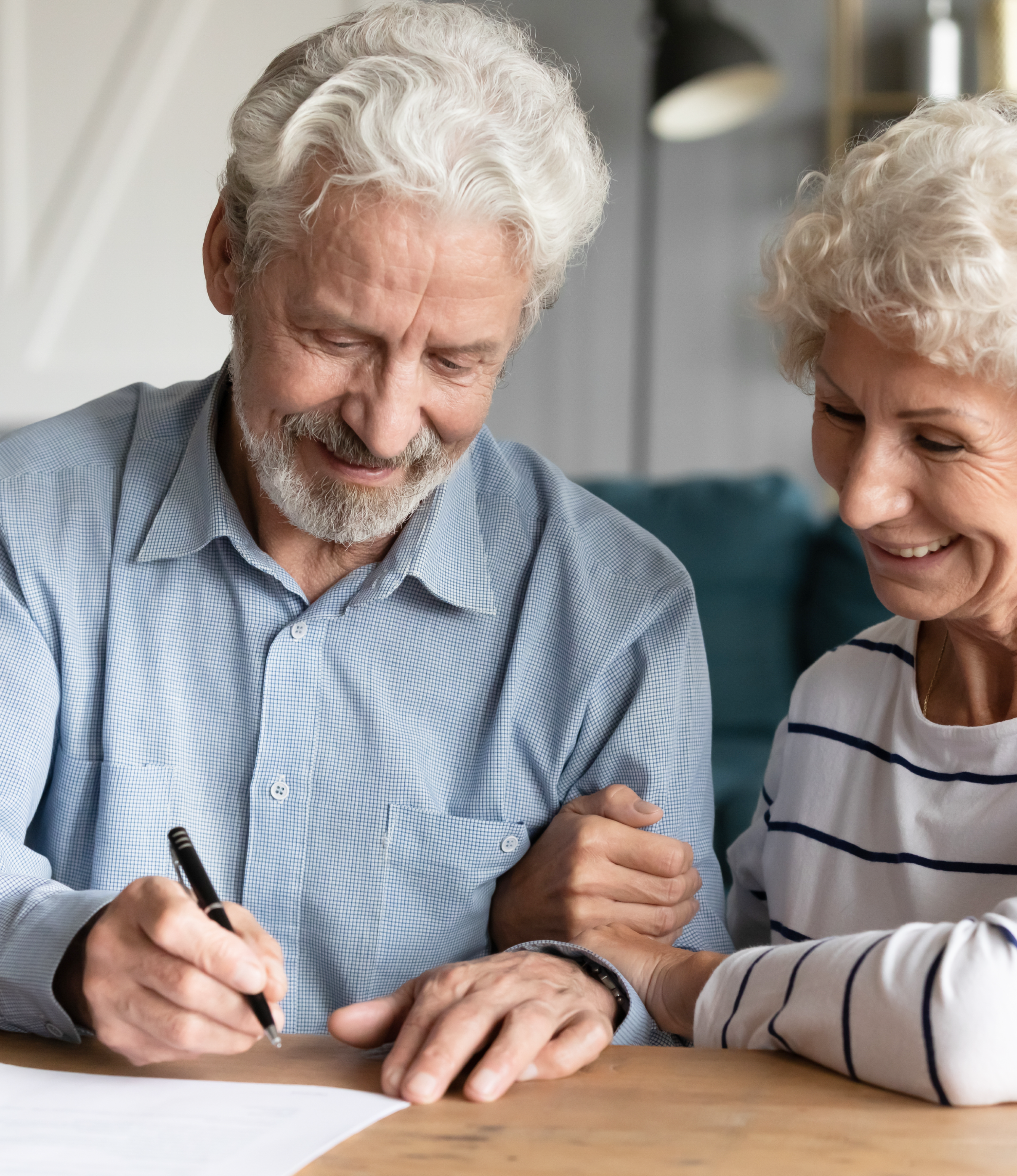 couple signing paper